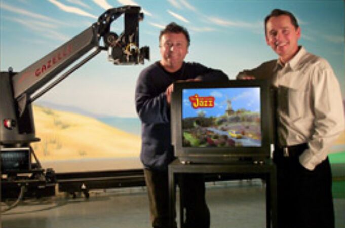 A potential still from the supposed lost behind the scenes video as it shows the founders of Anifex, Richard Chataway and Michael Cusack, posing next to a TV monitor that is displaying a frame from one of the Ever So Nice Jazz commercials.