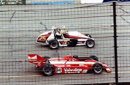 An IndyCar overtaking a Silver Crown car.