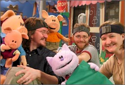 A photo of the show's puppet characters with (presumably) their puppeteers.