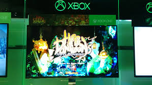 The game's E3 build is seen on an Xbox cabinet.