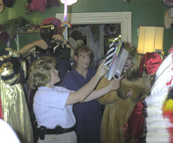 Filming at a real costume shop in Galveston Texas. Haylie is actually wearing one of the shop's costumes (back view, wearing red hat) Shelley Duvall (Aunt Nellie) can be seen in the center.