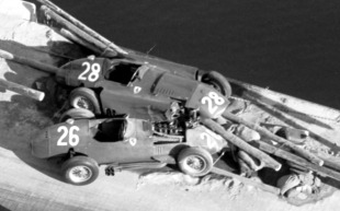 Collins and Hawthorn's Ferraris after crashing out.