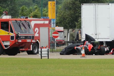 The Marussia cockpit covered up following the crash.