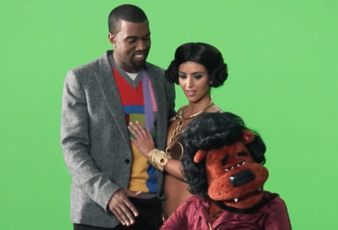 Set photo of Kim, Kanye, and the "Beary White" puppet.