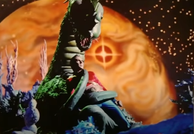 An 2nd image features Flash Gordon trapped by the bark (played by Paul Hubbard)