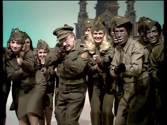 A rare still from the Black & White Minstrel Show featuring Captain Mainwaring with the minstrels.