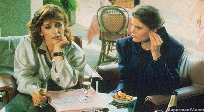 Lois and Lacy talk at a cafe.