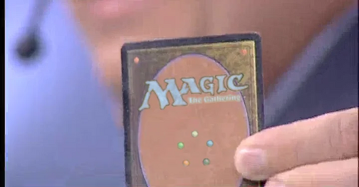 Gilbero shows a Magic: The gathering card to the camera