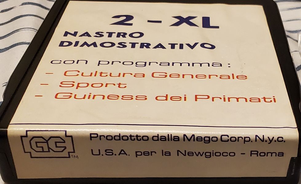 the edge of the "Nastro Dimostrativo" tape. This reveals a possible distributor name for the Italian release (Newgioco).