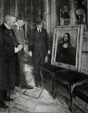 Giovanni Poggi (right) inspecting the painting.