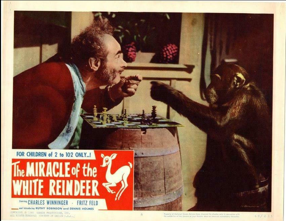 A color still frame or lobby card, showing the chess match.