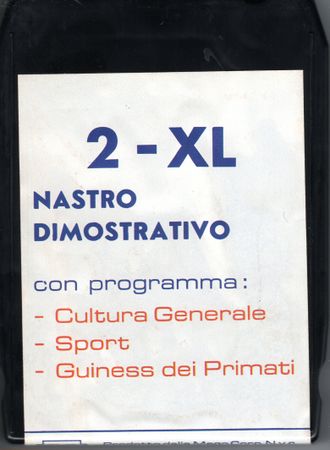 Photo of the cartridge label for "Nastro Dimostrativo" (Demonstration tape). This is the only known release for the Mego 2-XL in Italy.
