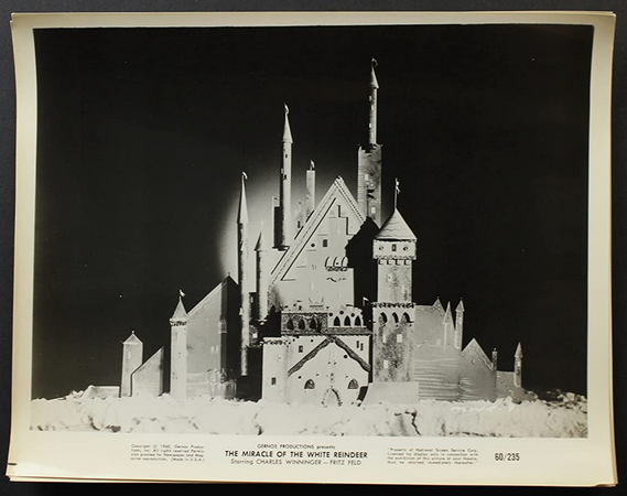 A black-and-white still frame or lobby card, possibly showing Santa's castle.