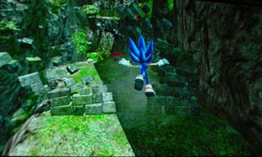 Sonic falling to the floor after knocking down a breakable wall near a spring.