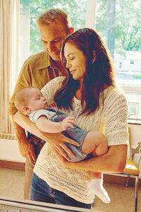 Jonathan and Martha Kent with baby Clark.