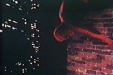 Production still from the film showing the wall-crawling effects in action.