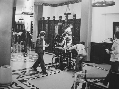 The crew filming Jack heading to investigate the elevator.