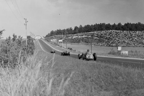 Behra ahead of Moss and Fangio.