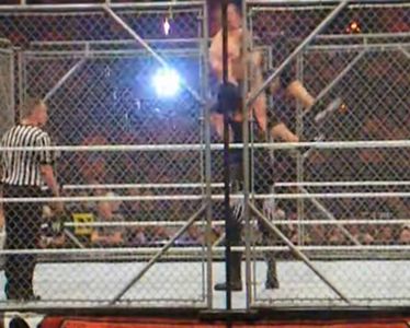 Undertaker hitting Cena with a chokeslam.