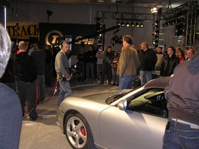 A Porsche 911, with Jeremy Clarkson's back to the camera.