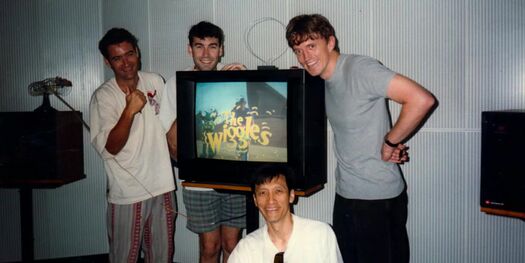 The Wiggles posing for a photo with the Pilot played on television.