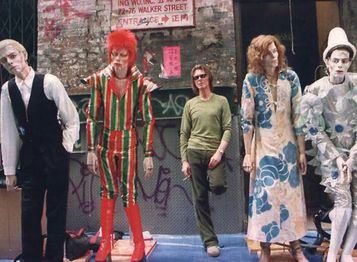 Promo pic of David Bowie with the four puppets.