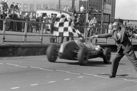 Brabham takes the chequered flag.