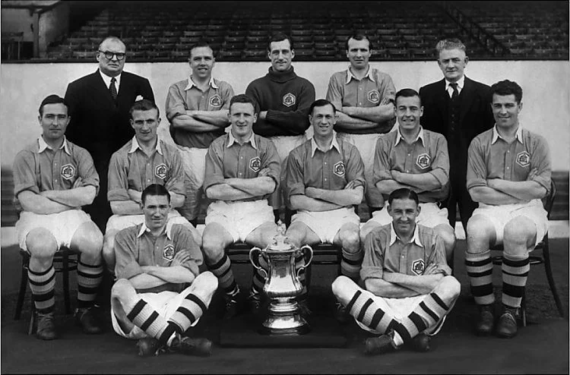 The Arsenal team with the trophy.