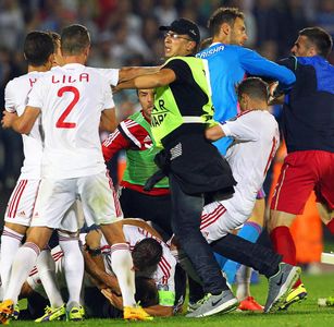 Lorik Cana about to punch the fan as the brawl spirals out of control.