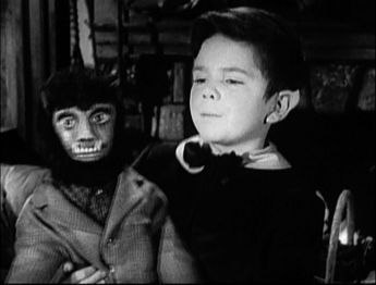 One of six screenshots of the second pilot version of My Fair Munster, taken from America's First Family of Fright, showing Eddie having just retrieved Wolf-Wolf back.