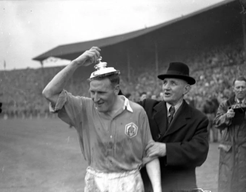 Alex Forbes tries the FA Cup lid as a hat.