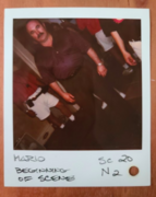 Continuity Polaroid of Mario dressing up for his date.