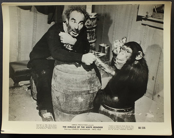 A black-and-white still frame or lobby card, showing the chimp.