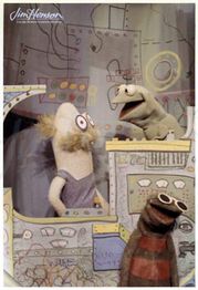 Kermit, Harry, and Madcliffe in a factory.