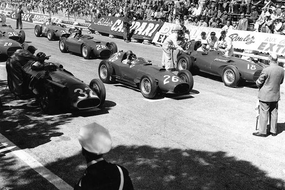 Fangio, Collins, and Moss line up at the start.