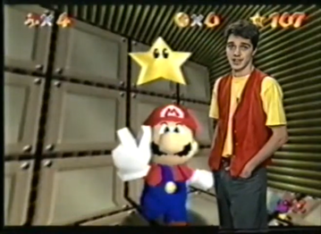 Screenshot showing host Cristiano Gualda in a green-screen on a Super Mario 64 screenshot.