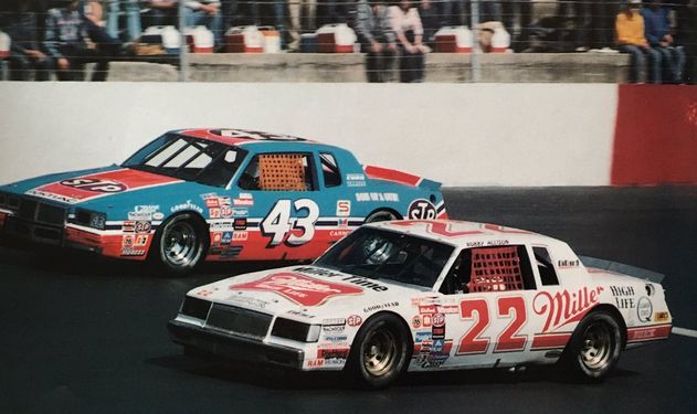 Bobby Allison (22) and Richard Petty (43) dueling each other.