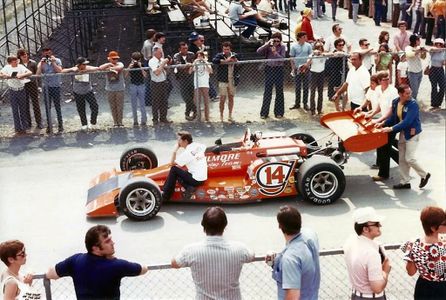 Foyt's car being pushed to the paddock.