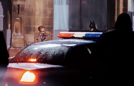 Set photo of Commissioner Gordon with Batman.