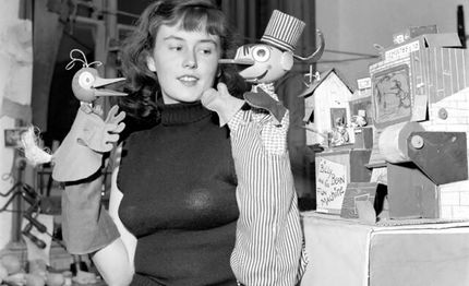 A photo of Billy and Yoo-hoo, along with one of the two puppeteers.